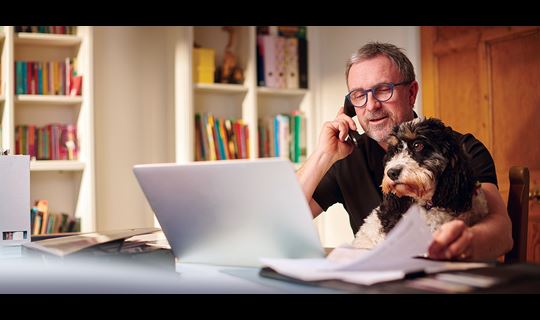 Man working from home with his dog